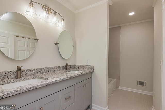 bathroom with crown molding and vanity