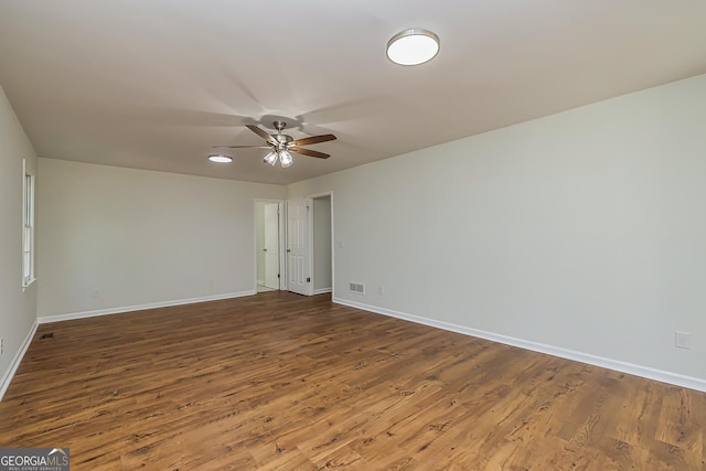 unfurnished room with ceiling fan and wood-type flooring