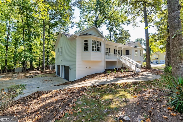 view of front of property featuring a garage and covered porch