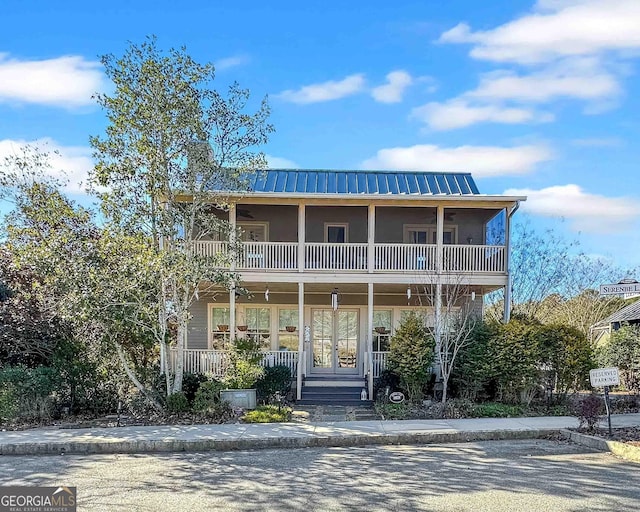 view of front of property with a balcony and covered porch