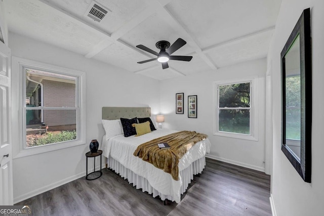 bedroom featuring hardwood / wood-style flooring, coffered ceiling, and multiple windows