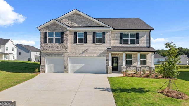 craftsman-style home with a garage, a front yard, and covered porch