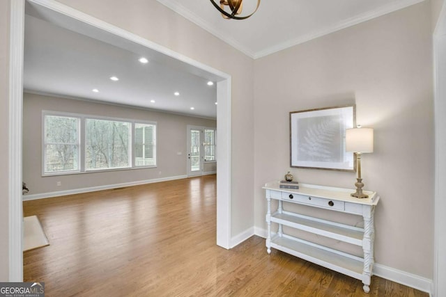 living room featuring crown molding and light wood-type flooring