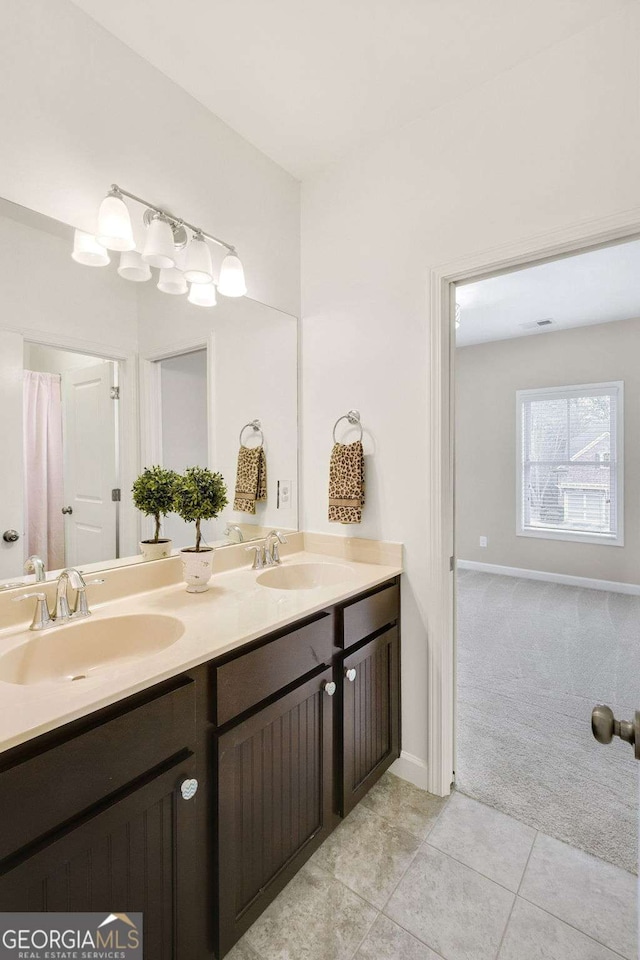 bathroom with vanity and tile patterned flooring