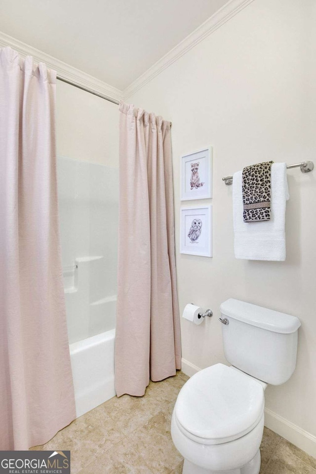 bathroom with ornamental molding, toilet, and shower / bath combo with shower curtain