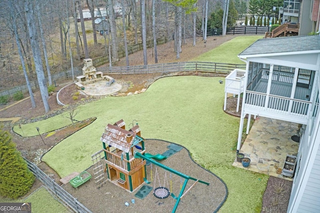 view of yard with a patio area and a playground