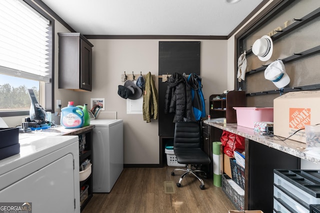 laundry room with dark hardwood / wood-style flooring, cabinets, ornamental molding, and independent washer and dryer