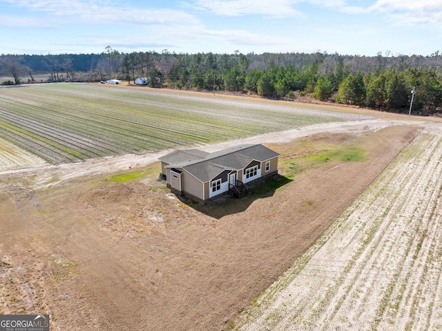 birds eye view of property featuring a rural view