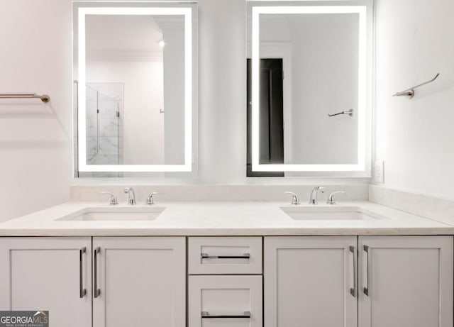 bathroom featuring walk in shower, vanity, and crown molding