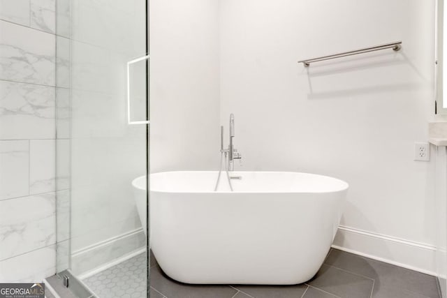 bathroom with tile patterned flooring and independent shower and bath