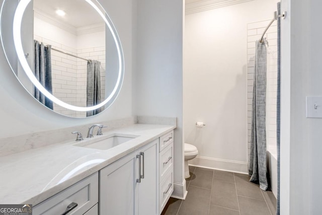 bathroom featuring crown molding, tile patterned floors, toilet, and vanity