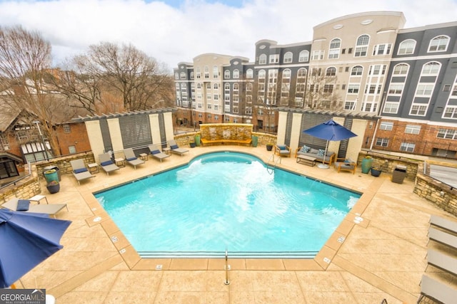 view of swimming pool with a patio area