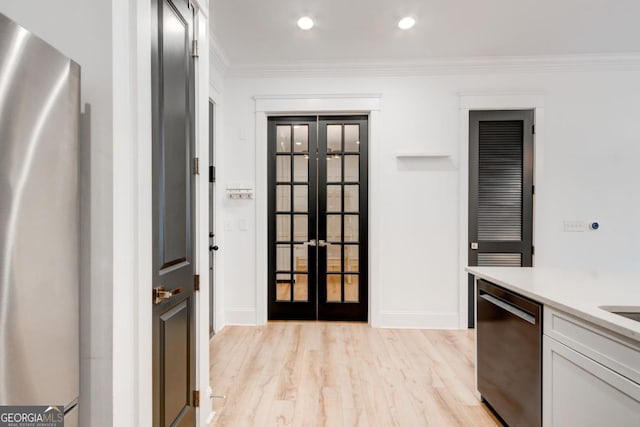 kitchen featuring stainless steel fridge, ornamental molding, french doors, and black dishwasher