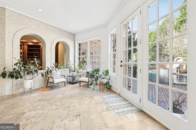 sunroom / solarium featuring plenty of natural light