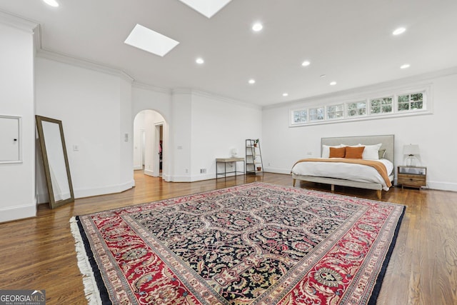 bedroom featuring hardwood / wood-style floors and crown molding