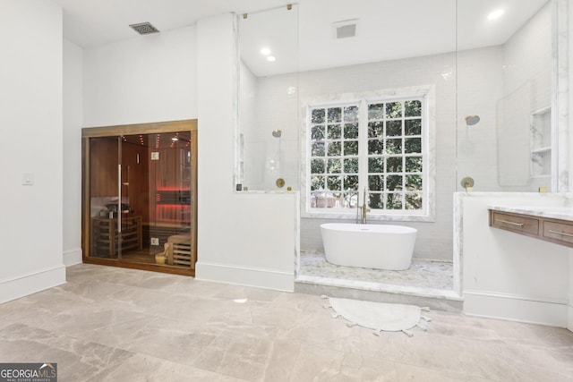 bathroom featuring vanity and separate shower and tub