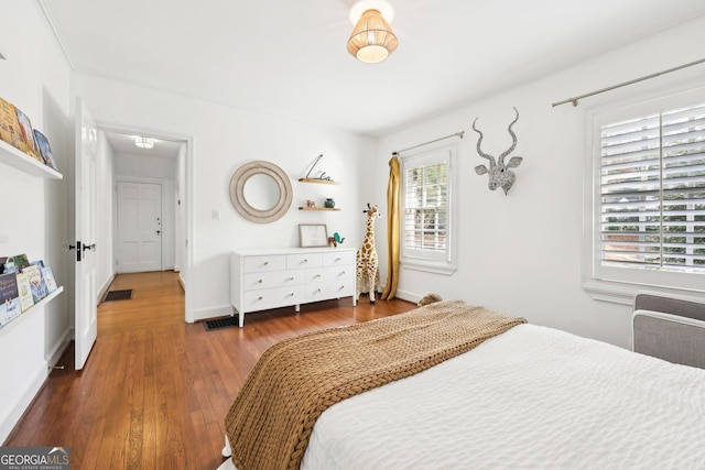 bedroom featuring dark hardwood / wood-style flooring