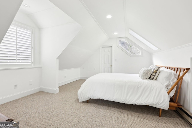 bedroom featuring carpet flooring, vaulted ceiling, and baseboard heating