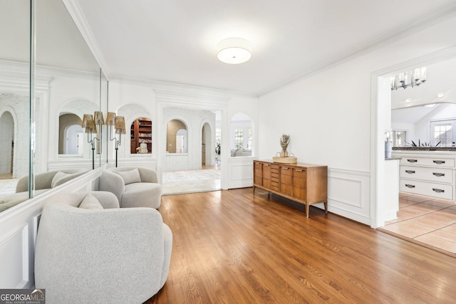 living room featuring hardwood / wood-style flooring and ornamental molding