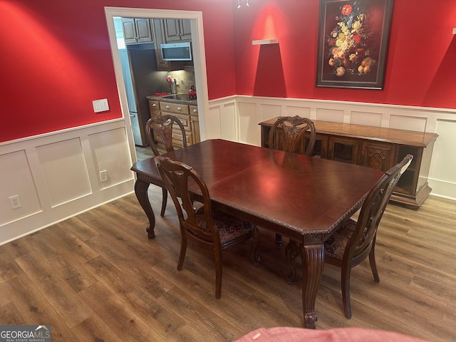 dining room with hardwood / wood-style floors