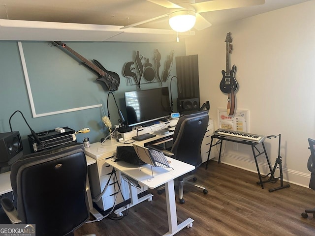 home office featuring dark hardwood / wood-style floors and ceiling fan