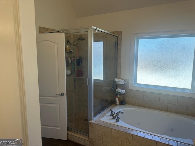 bathroom with shower with separate bathtub