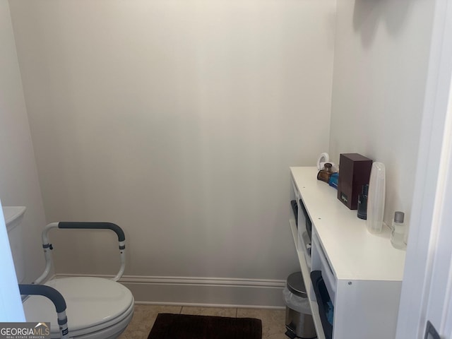 bathroom featuring vanity, toilet, and tile patterned flooring