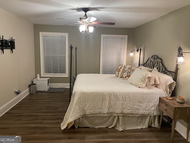 bedroom with ceiling fan and dark hardwood / wood-style flooring