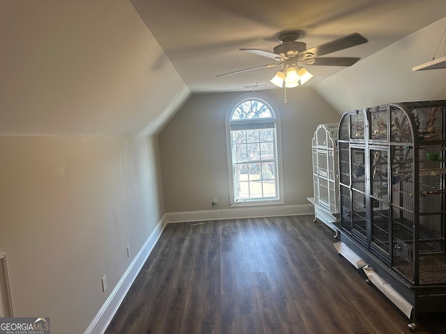 bonus room with ceiling fan, dark hardwood / wood-style floors, and vaulted ceiling