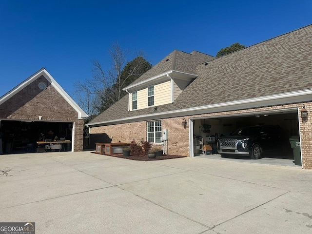 view of side of property with a garage