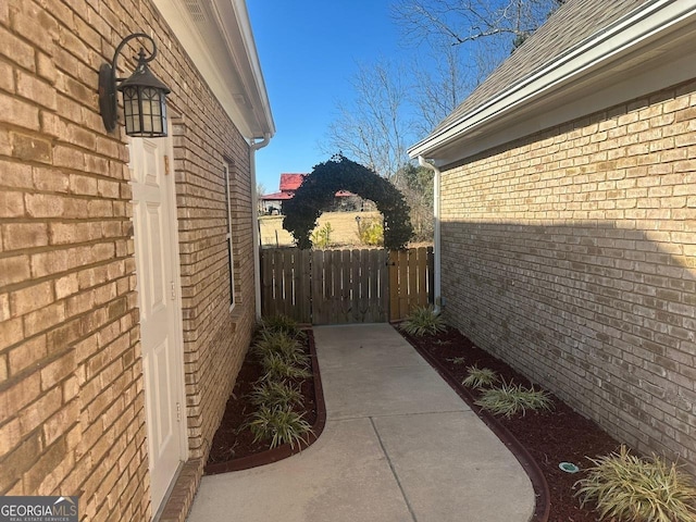 view of side of home with a patio area