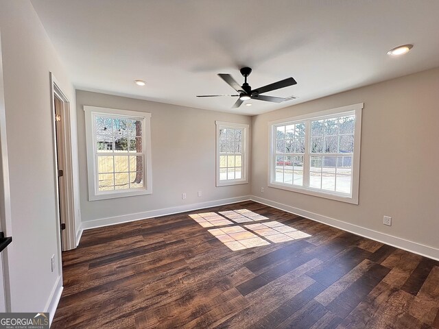 washroom featuring electric dryer hookup, washer hookup, dark hardwood / wood-style flooring, and a barn door