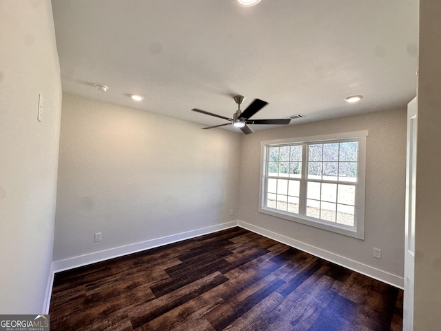 unfurnished room with baseboards, visible vents, ceiling fan, dark wood-type flooring, and recessed lighting