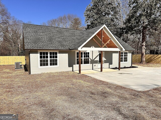 back of house featuring central AC and a patio