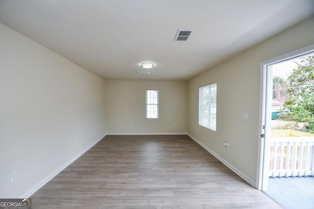 spare room featuring light hardwood / wood-style flooring