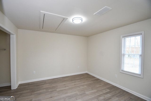 spare room featuring light hardwood / wood-style floors