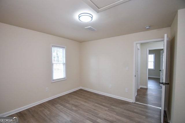 empty room with wood-type flooring