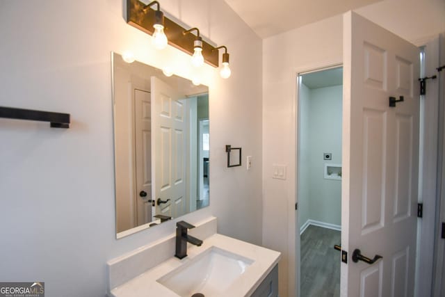 bathroom with vanity and hardwood / wood-style floors