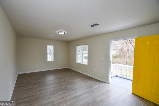 empty room featuring hardwood / wood-style floors