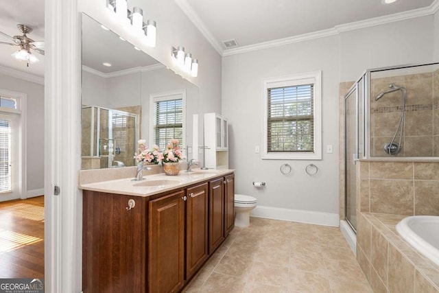 full bathroom with ceiling fan, vanity, ornamental molding, shower with separate bathtub, and toilet