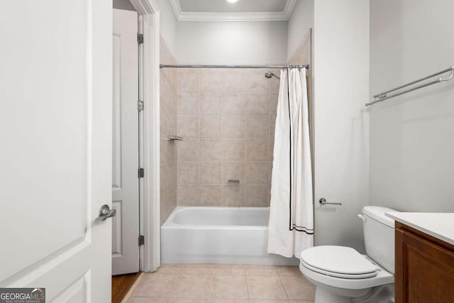 full bathroom featuring toilet, ornamental molding, vanity, shower / bath combo, and tile patterned flooring