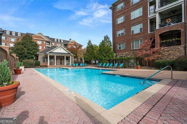 view of swimming pool featuring a patio