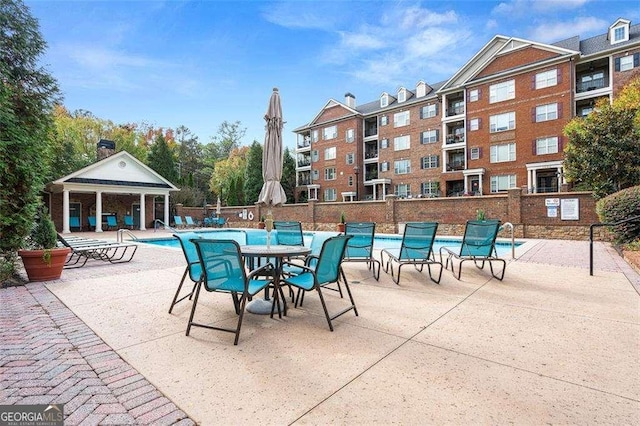 view of patio with a community pool