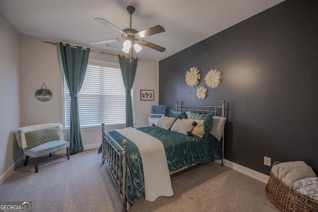 bedroom with carpet floors, baseboards, and a ceiling fan