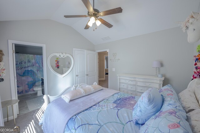 carpeted bedroom featuring lofted ceiling, ensuite bath, and ceiling fan