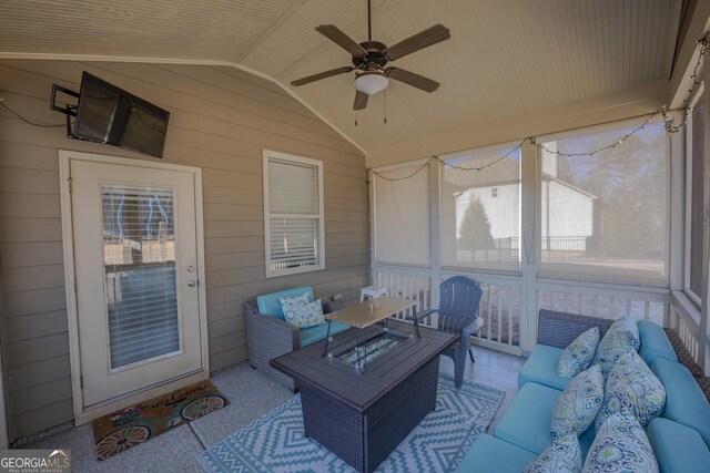 view of patio with an outdoor living space with a fire pit and ceiling fan