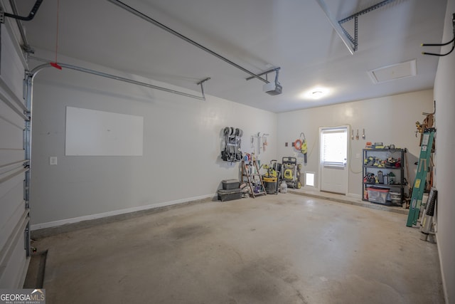 garage featuring baseboards and a garage door opener