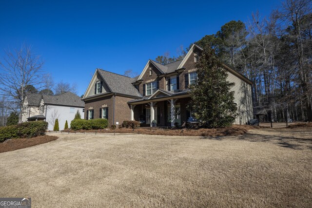 view of side of property featuring a trampoline, roof with shingles, concrete driveway, an attached garage, and fence