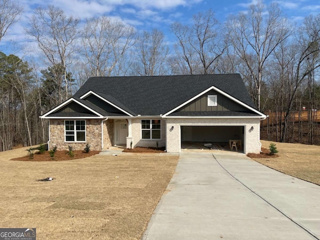 view of front of home with driveway, board and batten siding, and an attached garage