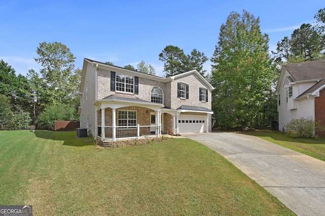 front of property featuring a garage, central AC, a front yard, and covered porch